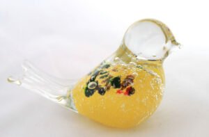 light yellow glass bird